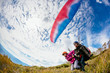 © Tandem Stock - A pilot and passenger run to generate lift at take off while tandem paragliding in the Blue Mountains.