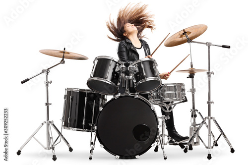 Fotomural Energetic female drummer throwing her hair and playing drums