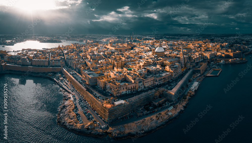 Obraz na płótnie City of Valletta, capital of Malta, aerial view, island in Mediterranean sea, dramatic sky w salonie