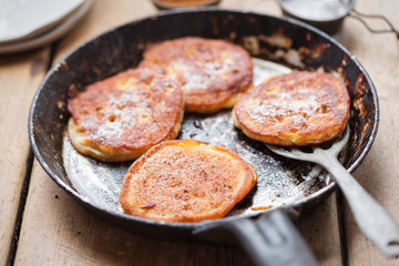 Wall Mural - Pancakes with apples, cinnamon and icing sugar 