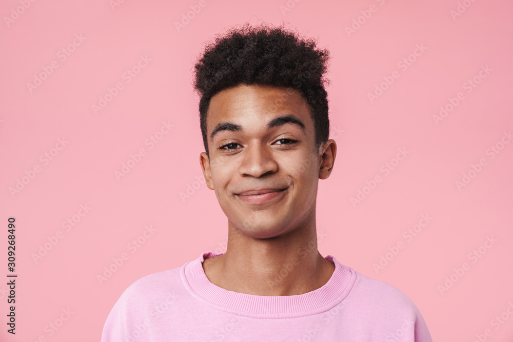 Portrait of a smiling african teenager boy wearing pullower - obrazy, fototapety, plakaty 