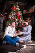 © Evgeny Leontiev - Portrait of a young couple in the living room at Christmas.