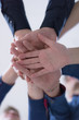 © as-artmedia - College Students Teamwork Stacking Hand Concept. Close up of young people putting their hands together. Friends with stack of hands showing unity and teamwork.