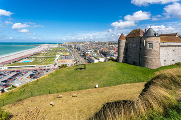 Panoramic view of Dieppe town, fishing port on the English Channel. On a clifftop overlooking pebbly Dieppe Beach is the centuries-old Chateau de Dieppe, now the museum. Sheeps gazing