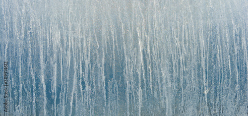 Ice background. The frozen texture of the water