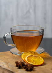 A warm cup of tea with orange and  anise ,herbal tee