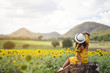 © suchalinee - asian woman travel at sunflower flower ,Nakhon Ratchasima Province, Thailand