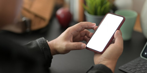 Canvas Print - cropped shot of young businessman using blank screen smartphone