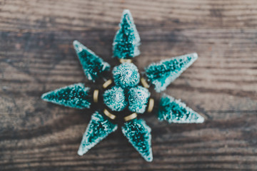 festive season's decorations group of miniature Christmas trees placed in shape of star