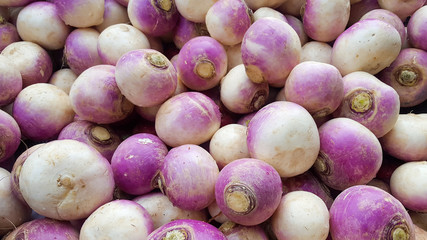 Wall Mural - Fresh, organic turnips, brassica rapa subsp, on display at a farmer's market stall in the UK