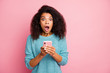 © deagreez - Close-up portrait of her she nice attractive lovely stunned cheerful overwhelmed wavy-haired girl using cell crazy news feedback isolated over pink pastel color background