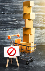 Wall Mural - Trading cart with boxes and an easel with a prohibition symbol NO. Internet trade online shopping ban. Restriction on importation goods, proprietary for business. Sanctions and economic restrictions