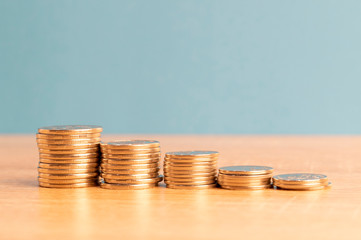 graph of falling coins on the table, blue background