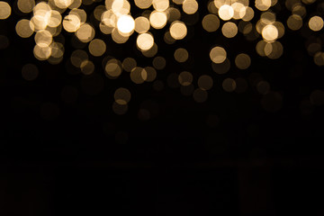 Abstract gold bokeh with black background