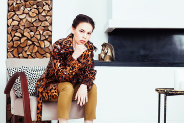 pretty stylish woman in fashion dress with leopard print in luxury house interior, lifestyle people concept