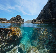 Rocky Coast With A Passage Between Rocks, Split View Over And Under Water Surface, Mediterranean Sea, Spain, Costa Brava, El Port De La Selva, Catalonia