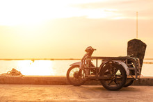  Sidecar Motorcicle Near The Sea With Sunset.