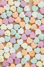 Conversation Candy Hearts On Pink Background, Copy Space, Valentines Background Photo