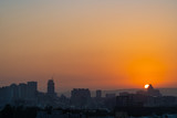 Fototapeta Nowy Jork - Modern city skyline in sunset time with colourful sky background