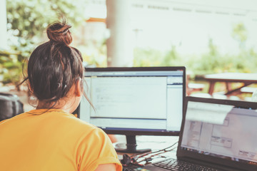 Women working with computer for design and coding program.