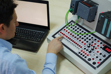an operator is taking plc course for industry 4.0 preparation in a automation education center. engi