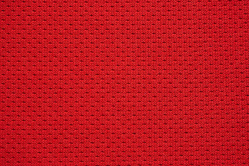 Red sports clothing fabric football jersey texture close up