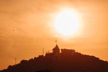 Wall Mural - Sunset at the temple above the hills in Wankaner, Gujarat, India