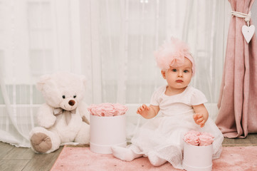 Portrait of adorable baby girl, birthday party for 1 year old kid