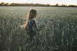 © Ira Efremova Photography/Stocksy - Long haired girl running through the field