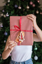 Young Woman Holding Red Xmas Gift