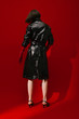 © ula? kesebir & merve t¸rkan/Stocksy - model with fake leather jacket on red background