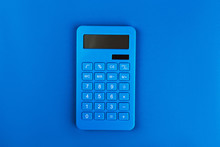 Blue Bright Calculator On A Blue Background
