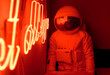 © Alexandr Ivanets/Stocksy - Anonymous astronaut sitting in cafe