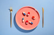 © Maki Company Limited/Stocksy - Pills on plate with fork. Pill instead of food.
