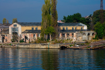 Wall Mural - Old and abandoned building on Golden Horn waterway (Altın Boynuz or Halic). Istanbul, Turkey