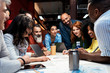 © Santi Nunez/Stocksy - Business group at a workshop in the office