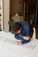 Artist Drawing Leaves Patterns On Paper