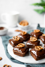 Peanut Brownies Topped With Dark Chocolate Ganache And Pretzels