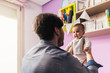 © Santi Nunez/Stocksy - Father and his baby having fun at home