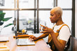 © Bonninstudio/Stocksy - Entrepreneur working in modern workspace.