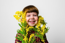 Toddler Girl Studio Portrait With Mimosa Flowers
