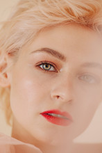 Closeup Face Portrait Of Blond Pretty Woman With Red Lips Looking At Camera