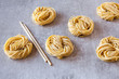 © Nadine Greeff/Stocksy - Dried egg noodles