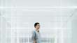 © JIACHUAN LIU/Stocksy - Business man in bright space