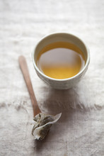 Herbal Tea In Ceramic Cup With Tea Bag On Spoon
