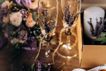 Two wedding champagne glasses decorated lavender. Love