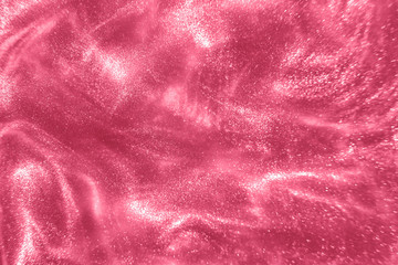 Wall Mural - Abstract elegant, detailed pink glitter particles flow with shallow depth of field underwater. Holiday magic shimmering luxury background. Festive sparkles and lights. de-focused.