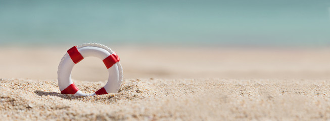 Lifebuoy On Sand At Beach