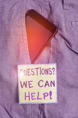 Text sign showing Questionsquestion We Can Help. Business photo text offering help to those who wants to know Smartphone device inside formal work trousers front pocket near note paper