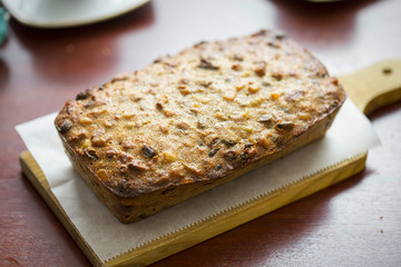 Wall Mural - Christmas loaf cake with pecans, raisins, figs, cherries and brandy